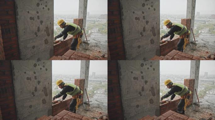 建筑工人钻孔盖房子建房子安全帽