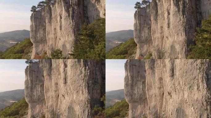 无人机: 在秋天的美好一天，男子在Crni Kal爬上具有挑战性的岩壁