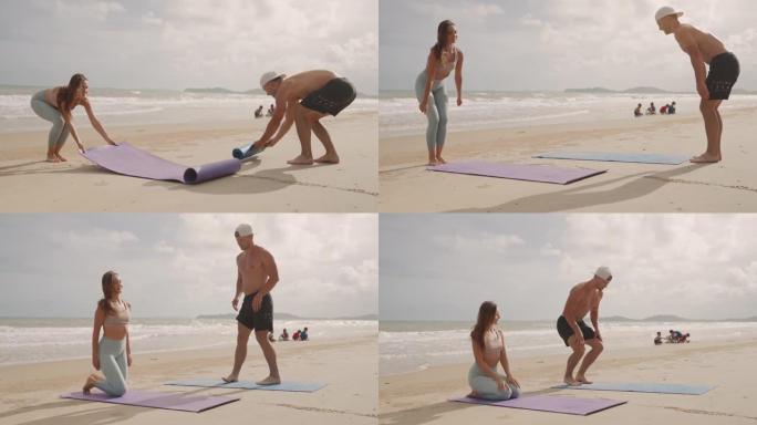 体育男女在海滩上准备瑜伽