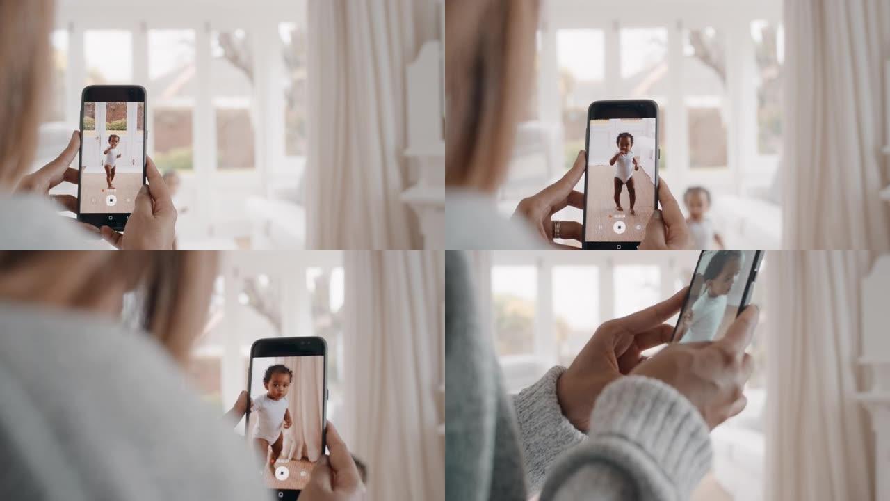 母亲用智能手机拍摄婴儿的视频，享受用手机相机拍摄快乐的幼儿，在社交媒体上分享母亲的生活方式4k镜头