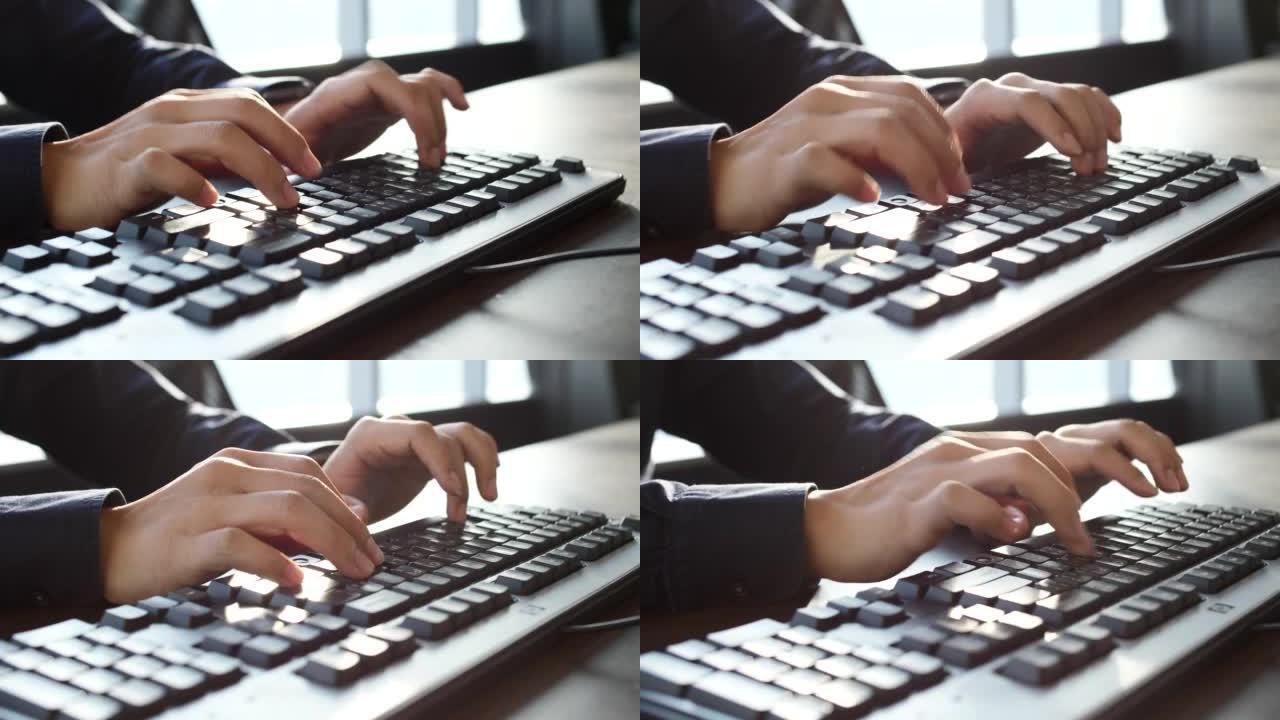 在键盘上手工打字电脑桌