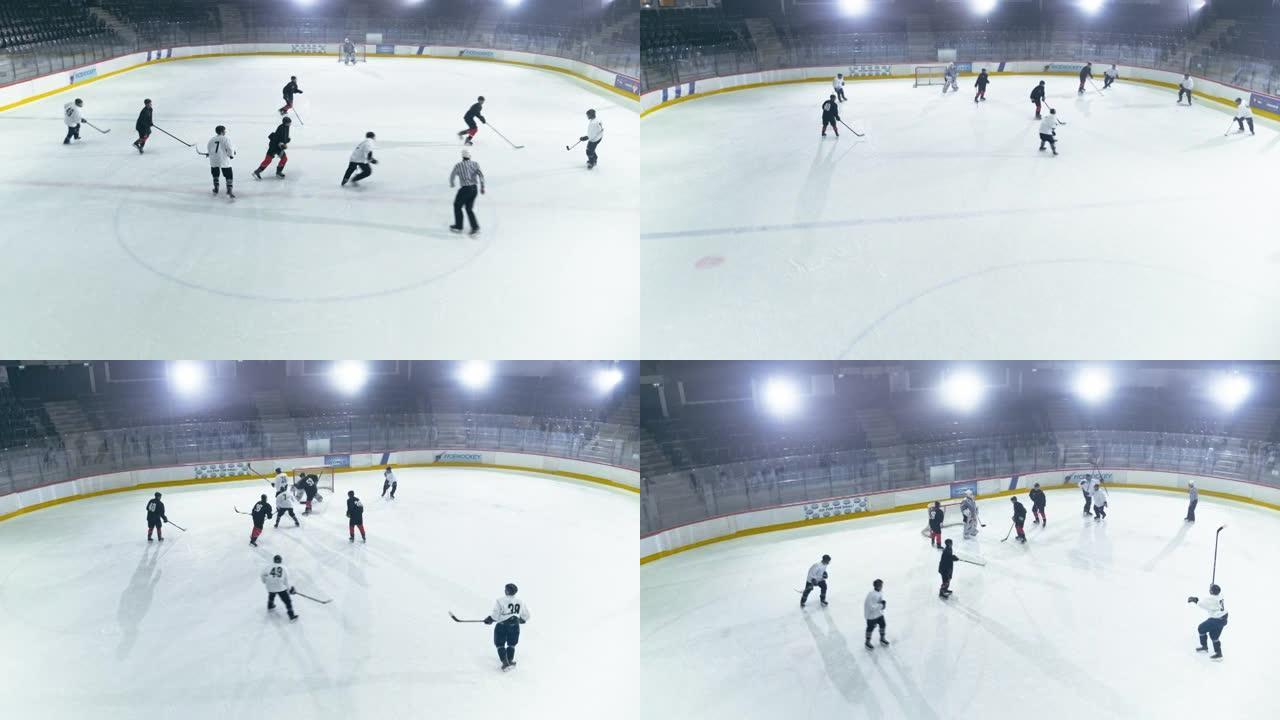 空中冰球溜冰场竞技场比赛开始: 两名球员残酷面对，裁判丢下冰球，当守门员错过冰球时，以精湛的运球球员
