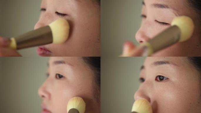 亚洲女性在家化妆特写