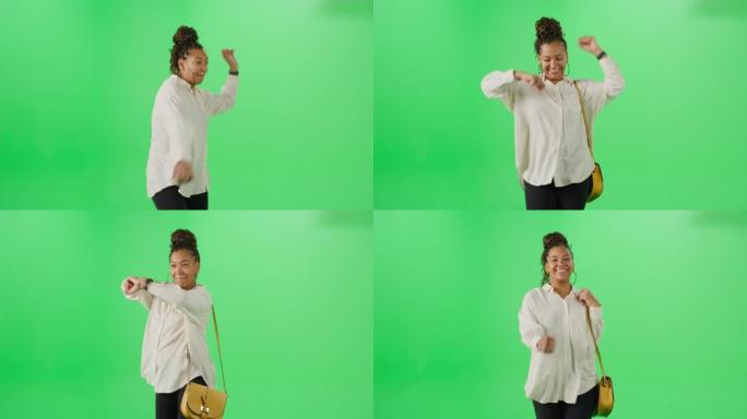 绿屏背景: 超级快乐的黑人女人走路，跳舞。一个微笑、开朗的女人的中等肖像享受着她的一天。色度键隔离模