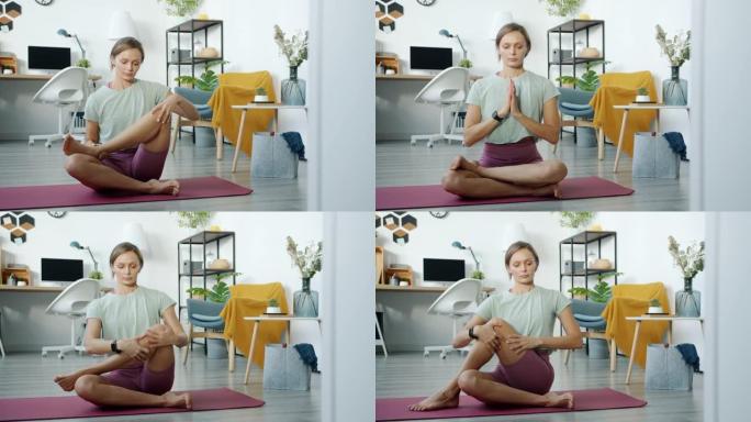 穿着运动服训练在家做瑜伽的好看女孩的慢动作肖像