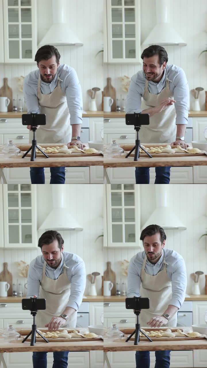 英俊的千禧一代男子在厨房录制烹饪视频