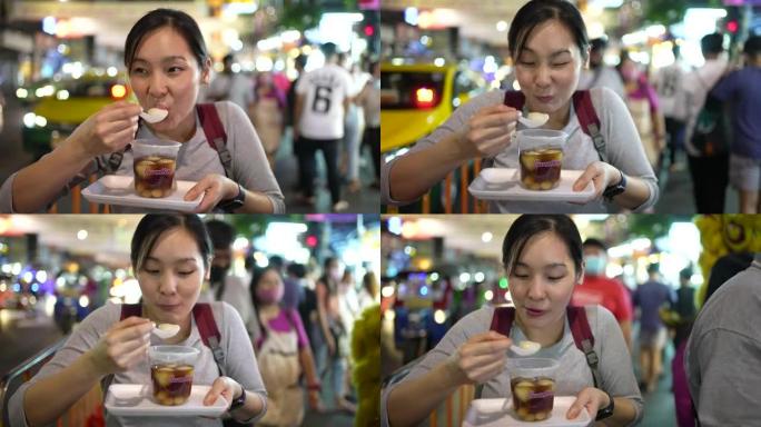 吃街头食物的亚洲女人