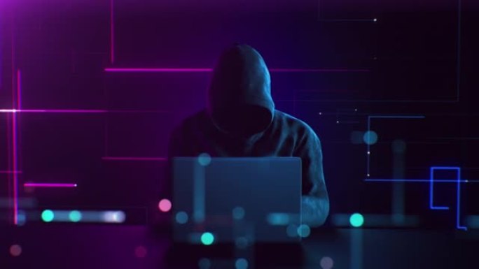 无法识别的黑客在数字环境中工作在笔记本电脑上。摘要匿名男子打字，侵入安全系统。网络犯罪和互联网保护技