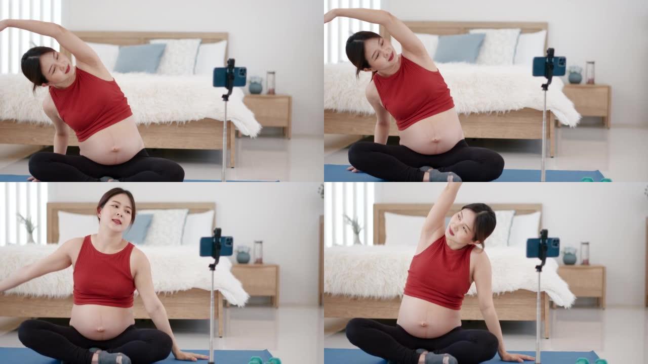 怀孕的亚洲年轻女子练习瑜伽呼吸冥想