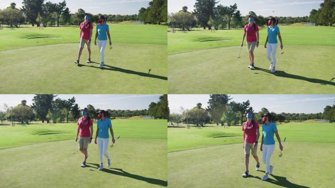 两名戴着口罩打高尔夫球的白人妇女一起散步