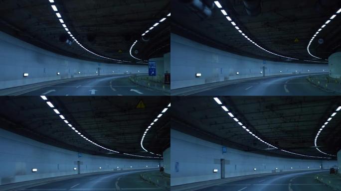 POV汽车在高速公路上的隧道中夜间行驶