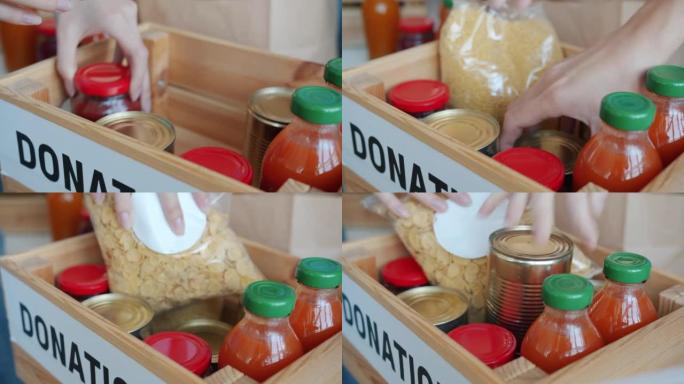 木箱的特写镜头，里面有食物，人手志愿者为慈善事业提供服务