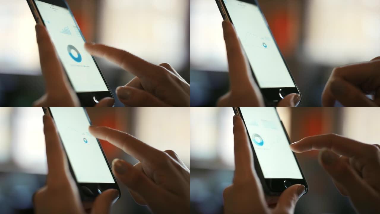 一名妇女使用智能手机查看财务报告的4k视频片段