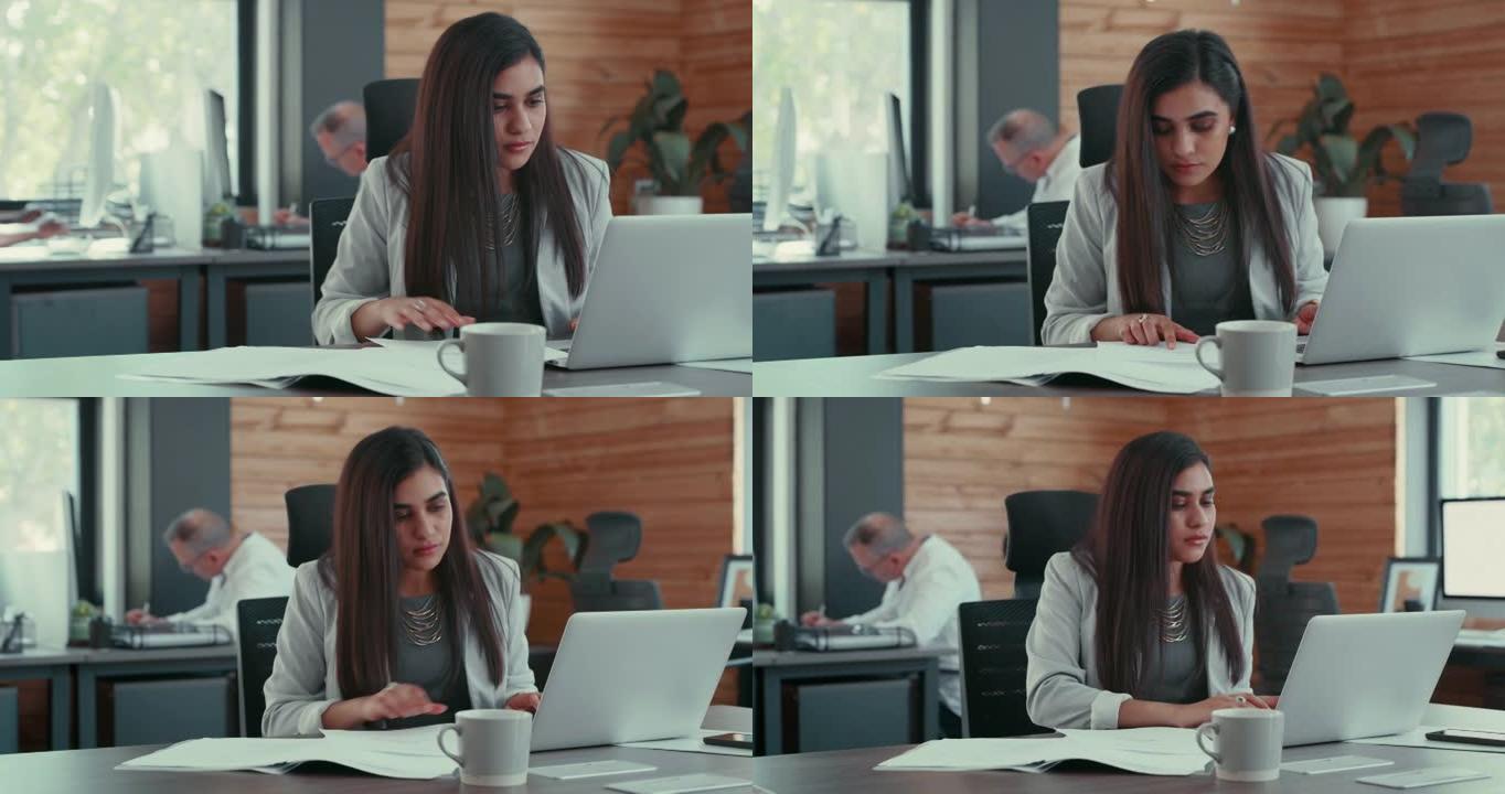 一名年轻女商人在使用笔记本电脑之前阅读文档的4k视频片段