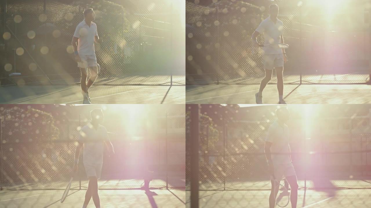 适合成熟的男人带着球拍和网球走进网球场