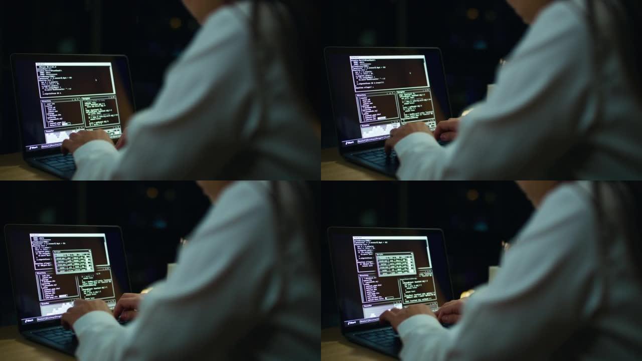 晚上在笔记本电脑键盘上打字的程序员/黑客