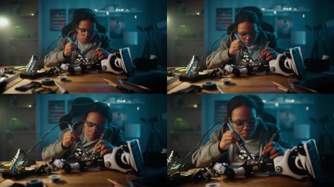 年轻的多种族女学生正在她的科学爱好机器人项目中学习电子产品，焊接线和电路板。女孩正在她的房间里研究一