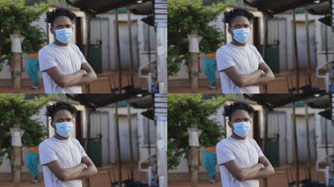 贫困，不平等，贫民窟里一个戴着保护面罩的非洲黑人看着镜头的肖像。