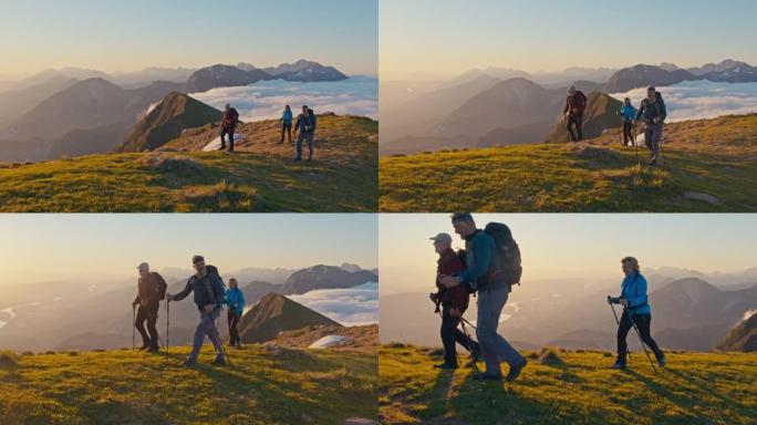 SLO MO远足者在日落时在山脊上行走