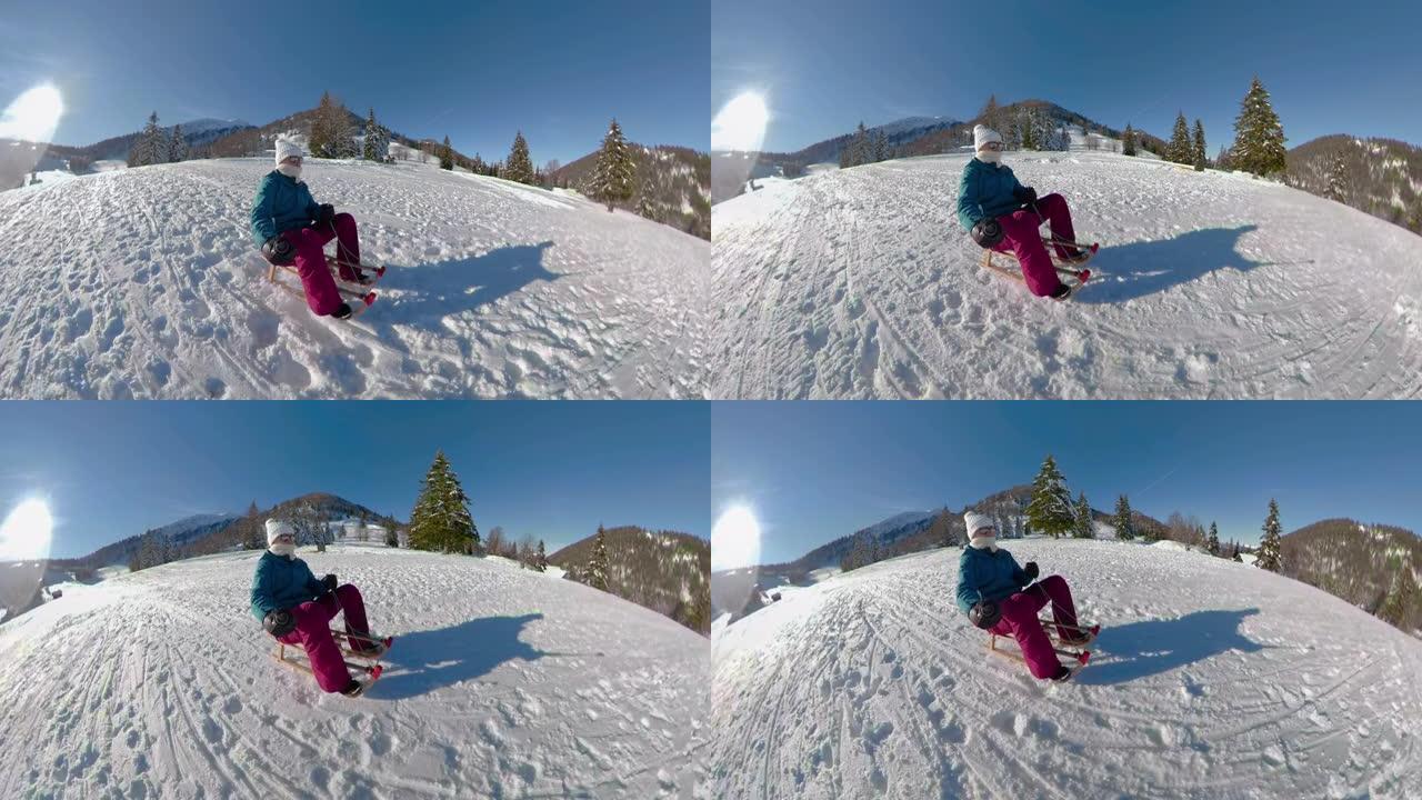 自拍照: 活跃的年轻白人妇女在阳光明媚的冬日里滑下雪山