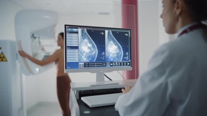 医院放射科的电脑屏幕: 美丽的多种族成年女性，赤裸上身接受乳房x光检查。屏幕显示密集乳腺组织的乳房x