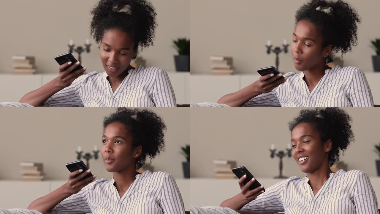 手持智能手机的混血女人通过免提电话与朋友交谈