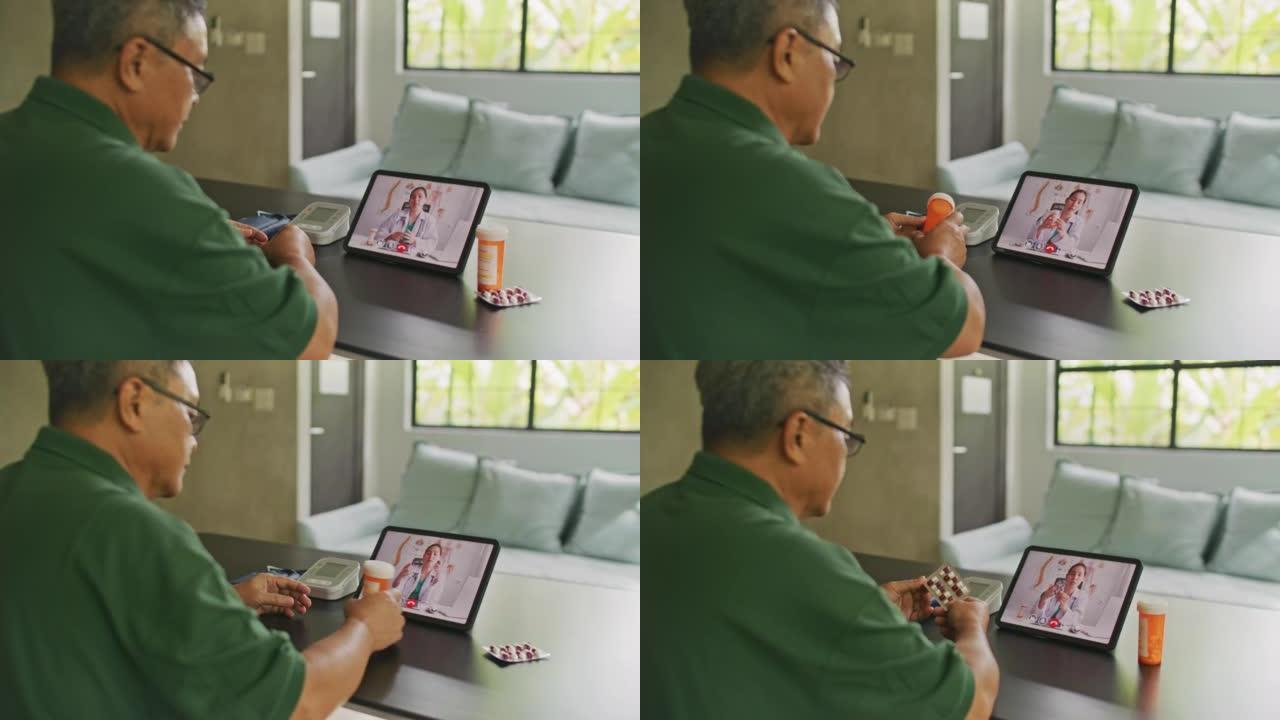 高级男子在家中与客厅的女医生在数字平板电脑上进行远程视频通话远程医疗会议