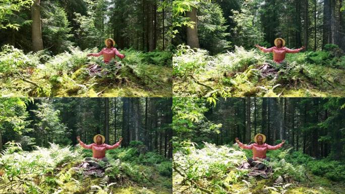 年轻女子在户外森林林地练习瑜伽冥想