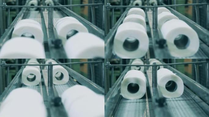 卫生纸在造纸厂沿输送机移动的特写镜头