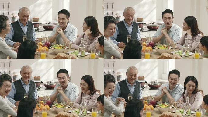 三代亚洲家庭在家用餐