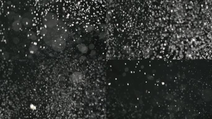 黑色背景上的SLO MO落雪纹理背景