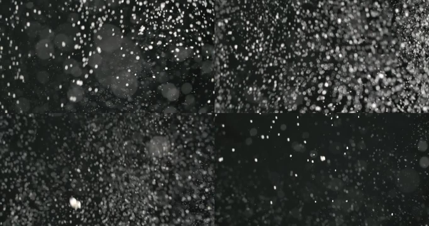 黑色背景上的SLO MO落雪纹理背景