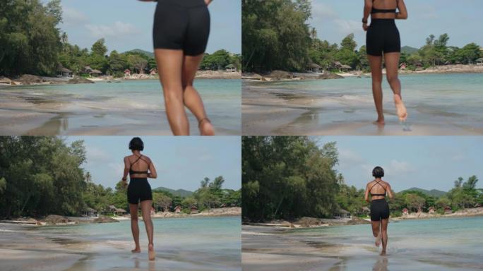 女人在沙滩上慢跑沙滩跑步