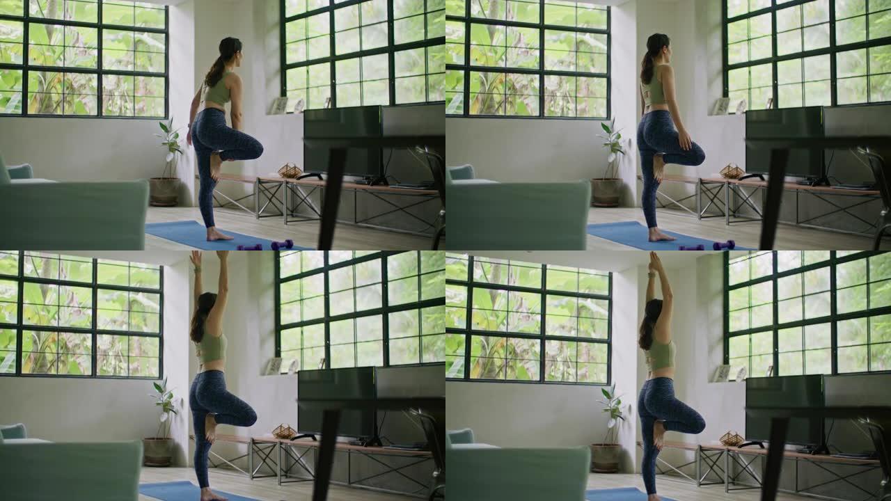运动女人在家做瑜伽