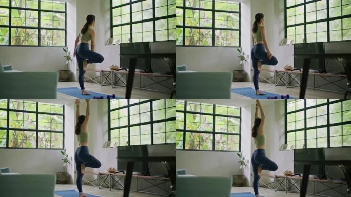 运动女人在家做瑜伽