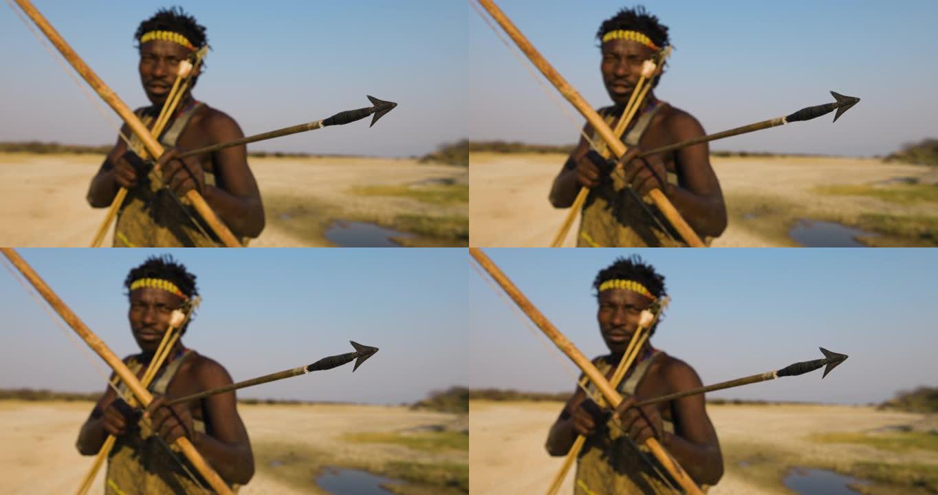 特写哈扎狩猎采集部落旨在拍摄他的弓箭坦桑尼亚