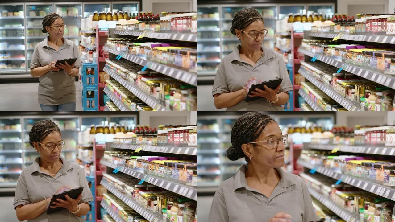 高级女售货员在超市检查库存