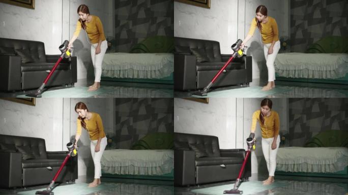 女人用吸尘器清洁地板