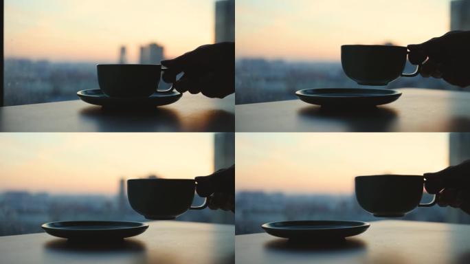 早上手捧咖啡杯早上桌上的一杯咖啡清晨上班