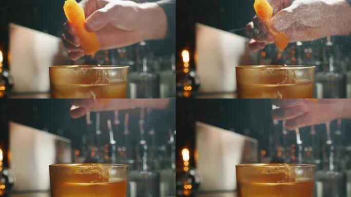 专业调酒师的特写镜头是在酒吧或迪斯科俱乐部为顾客准备含冰块的酒精鸡尾酒时挤压橙子。