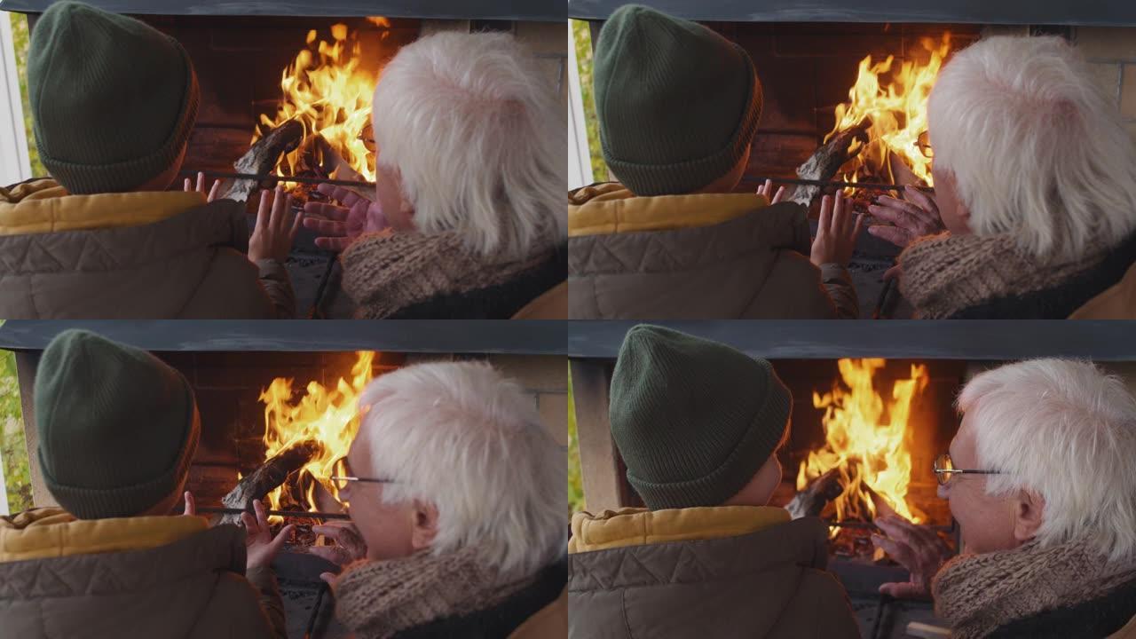 孩子和爷爷用火取暖和聊天