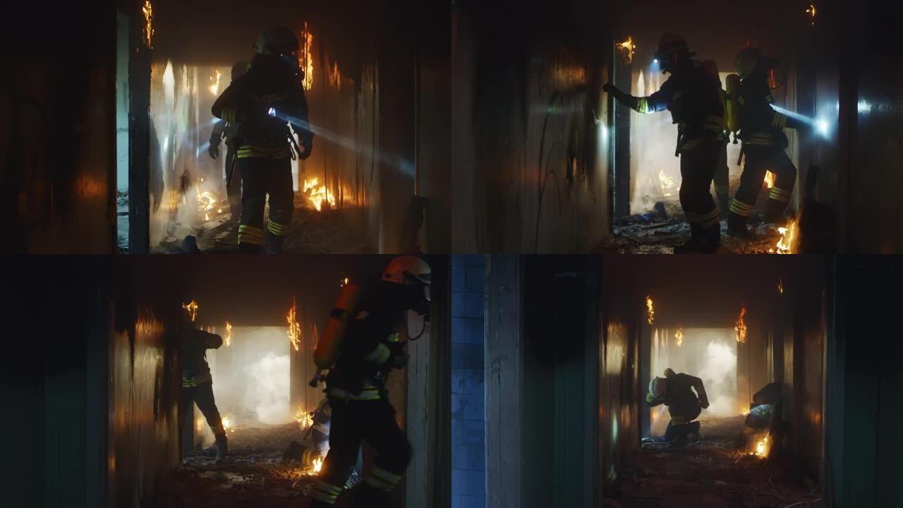 消防员在救援行动中检查燃烧的走廊