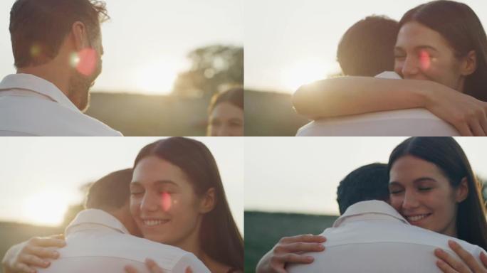 在日落时分，风景秀丽的葡萄园背景上，幸福的情侣真实的镜头是一起享受时光和拥抱，这是永恒爱情的标志。概