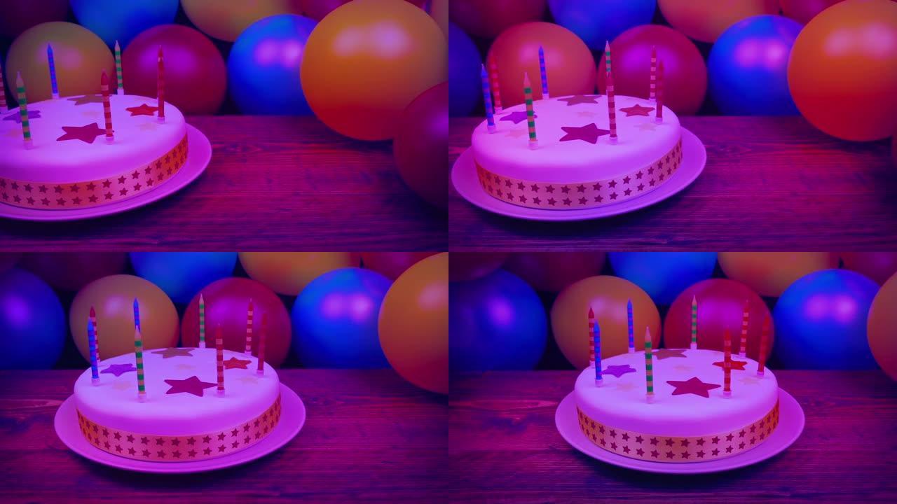 派对灯光下的生日蛋糕和气球
