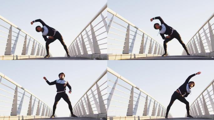 非裔美国人在户外锻炼，站在行人天桥上从腰部伸展