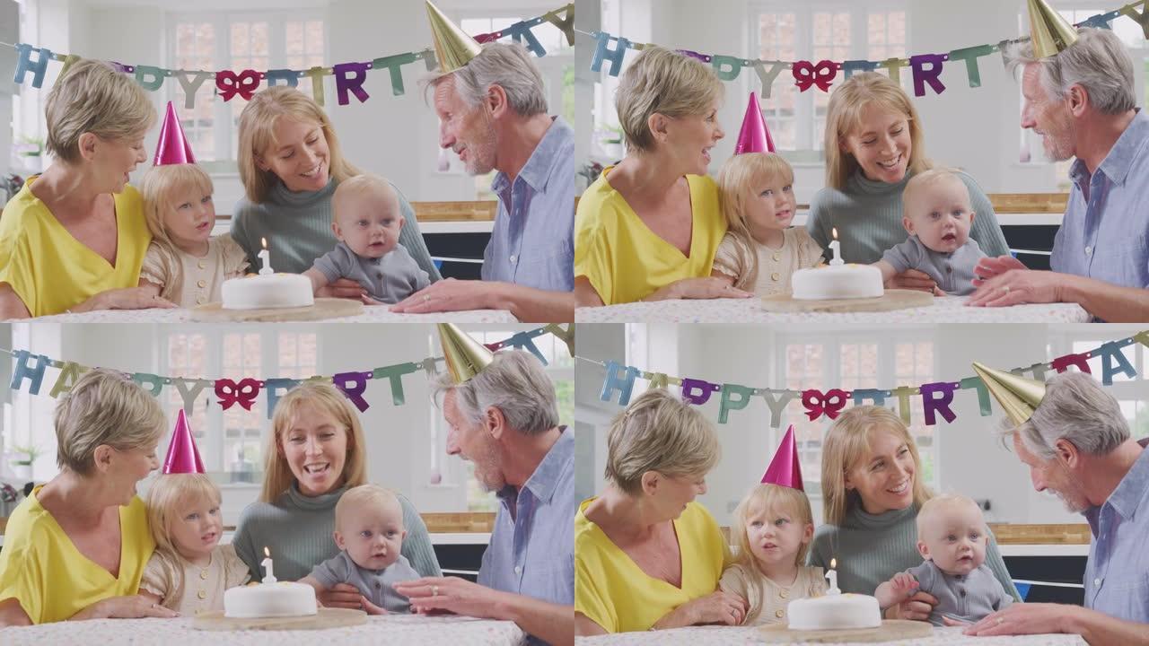 祖父母和母亲在家里的第一个生日聚会上给孙子唱生日快乐