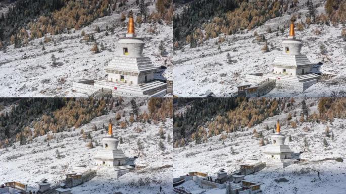 一座宝塔矗立在雪山上五彩缤纷的森林中