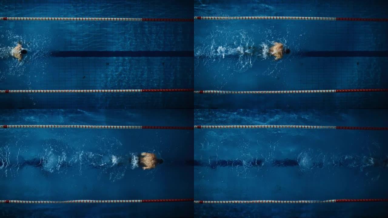 空中俯视图: 游泳池中的男性游泳运动员。职业运动员以蝶式游泳，赢得冠军。深色戏剧性的颜色，电影圈车道