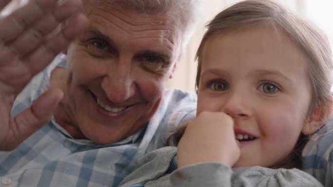 祖父和孩子有视频聊天小女孩与家人分享假期周末爷爷喜欢在家与孙女pov 4k在移动技术上聊天