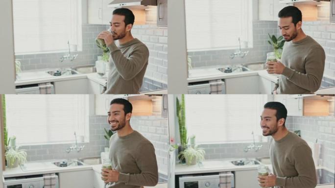 快乐的男人，健康的冰沙和绿色果汁在厨房里喝早餐，营养和早晨的能量。微笑年轻人喝乳清蛋白补充剂，排毒饮